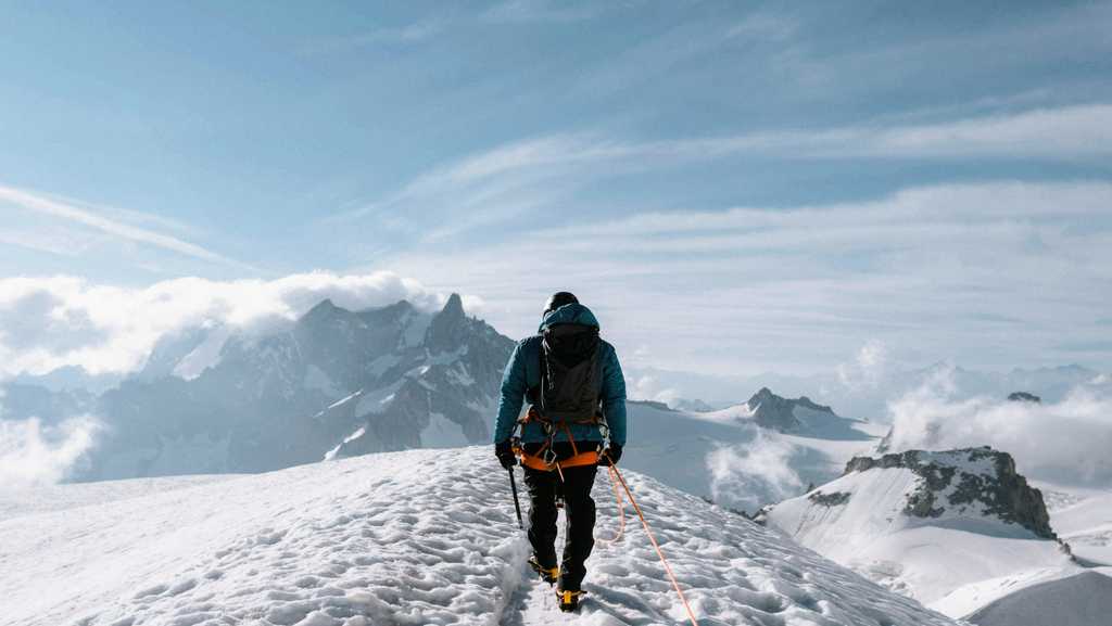 View of Kedarkantha peak covered in snow during winter trek in Uttarakhand.